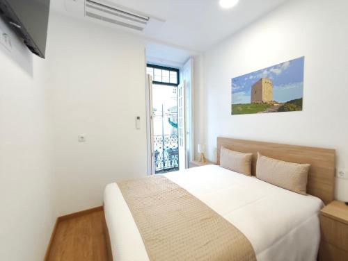 Postel nebo postele na pokoji v ubytování Misericórdia Rooms