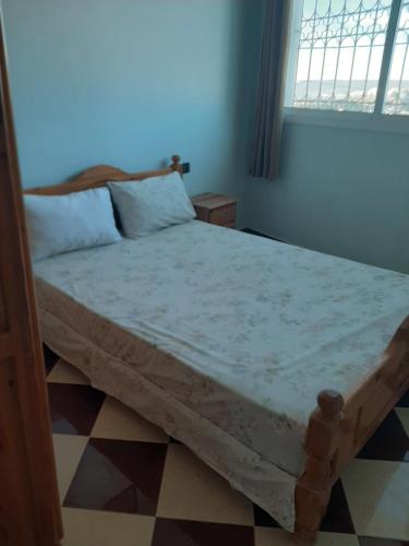 Ένα ή περισσότερα κρεβάτια σε δωμάτιο στο agadir location vacance aourir plage