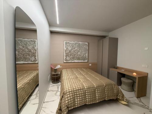 Ένα ή περισσότερα κρεβάτια σε δωμάτιο στο Porta Bari Rooms
