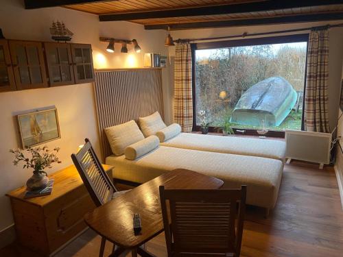 Postel nebo postele na pokoji v ubytování Haffidylle Familie Bress