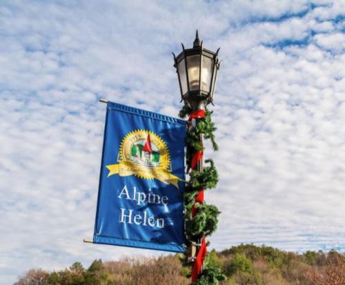 a light pole with a blue flag on it at IGLS Resort Villas at Innsbruck in Helen