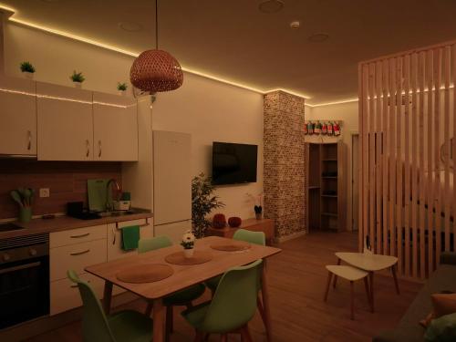 a kitchen and dining room with a table and chairs at HY Station Malaga in Málaga