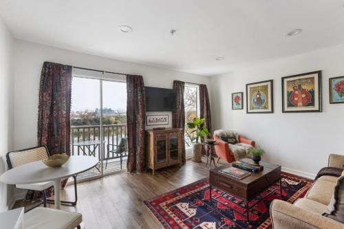 a living room with a couch and a table at Downtown Nashville Riverfront Unit 820 in Nashville