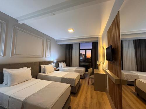 Ένα ή περισσότερα κρεβάτια σε δωμάτιο στο Remida Managed By Dedeman