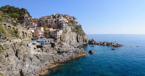 a view of a positano village on a cliff at The Sea View Attic in Manarola