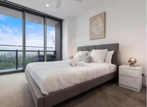 Ένα ή περισσότερα κρεβάτια σε δωμάτιο στο Luxury Beachside Apartment