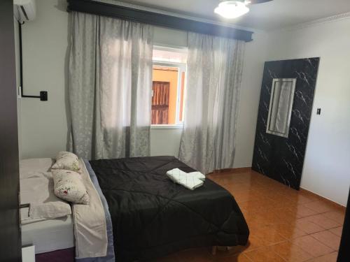 Ένα ή περισσότερα κρεβάτια σε δωμάτιο στο Casa temporada