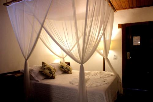 Postel nebo postele na pokoji v ubytování Rede Andrade Galeão