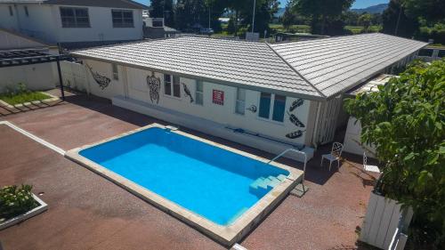an overhead view of a house with a swimming pool at Marsden Stay Rotorua in Rotorua