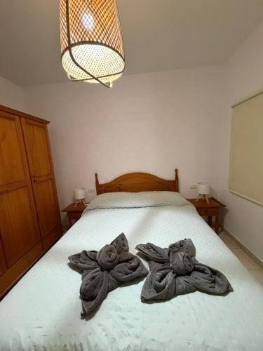 Ένα ή περισσότερα κρεβάτια σε δωμάτιο στο Jimaguas