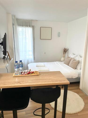 Ένα ή περισσότερα κρεβάτια σε δωμάτιο στο Le Michel Ange