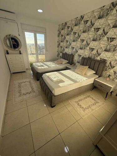 Giường trong phòng chung tại Magnifique appartement résidence