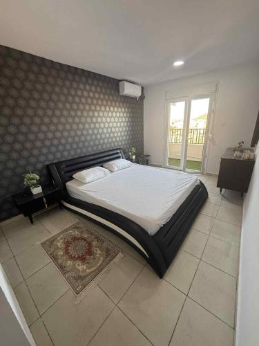 Giường trong phòng chung tại Magnifique appartement résidence