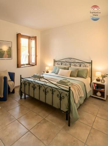 a bedroom with a large bed in a room at TraMonti e Mare in Scalea
