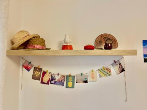 a shelf with christmas cards and other decorations on it at Apartamento Sant Josep in Canet de Mar