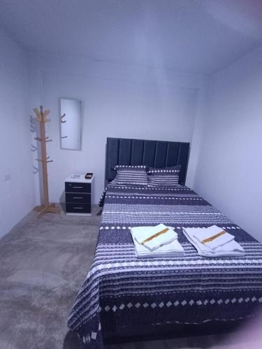 Una cama o camas en una habitación de Hospedaje C y A