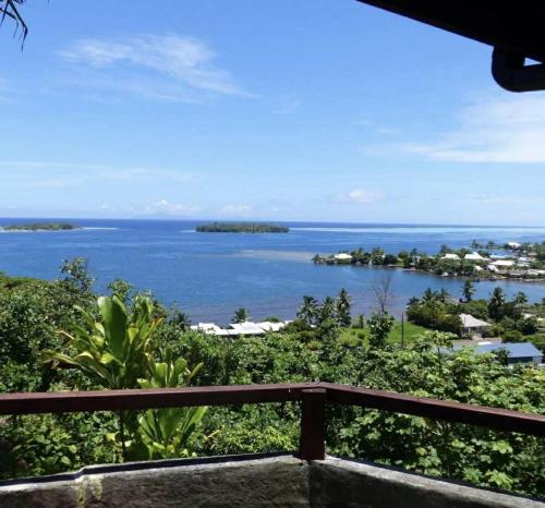 a view of the ocean from a balcony at Bungalow studio in Raiatea
