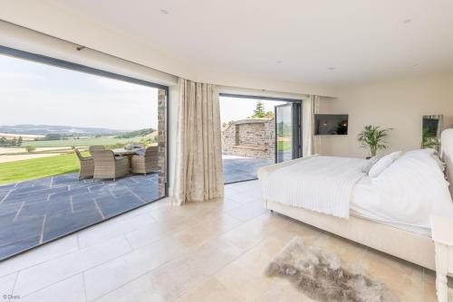 Postel nebo postele na pokoji v ubytování Llety-Cariad