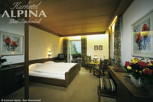 Postel nebo postele na pokoji v ubytování Hotel Alpina