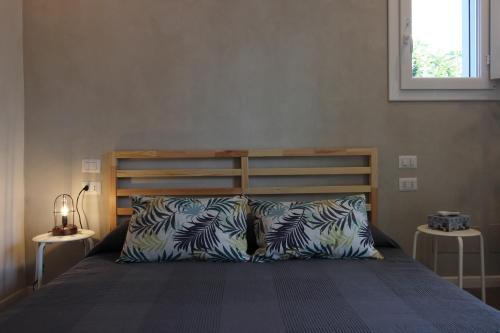 Un pat sau paturi într-o cameră la Il Giardino di Angelo e Margherita