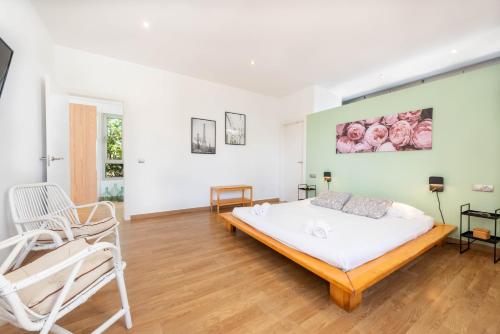 En eller flere senge i et værelse på Finca can Miquel i Xisca