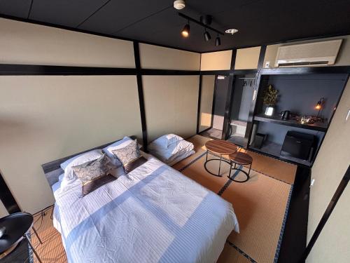 Ένα ή περισσότερα κρεβάτια σε δωμάτιο στο Alim STAY IZU アリムステイ 伊豆