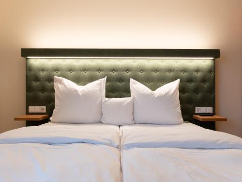 Ένα ή περισσότερα κρεβάτια σε δωμάτιο στο Gutshotel Odelzhausen