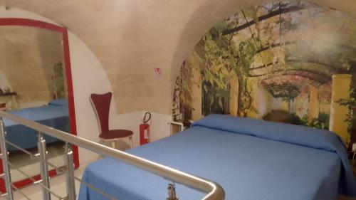 Кровать или кровати в номере Casina nella corte