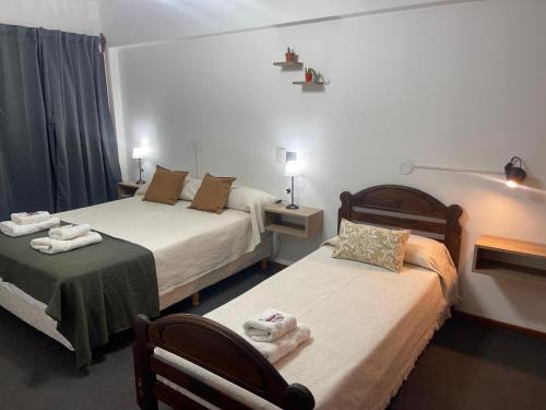 Postel nebo postele na pokoji v ubytování Hotel Palo Verde