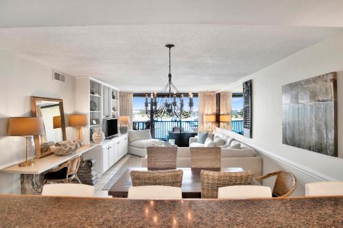 a living room with a couch and a table at Wind Drift 313N in Orange Beach