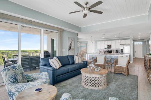 a living room with a couch and a table at The Wharf 701 in Orange Beach