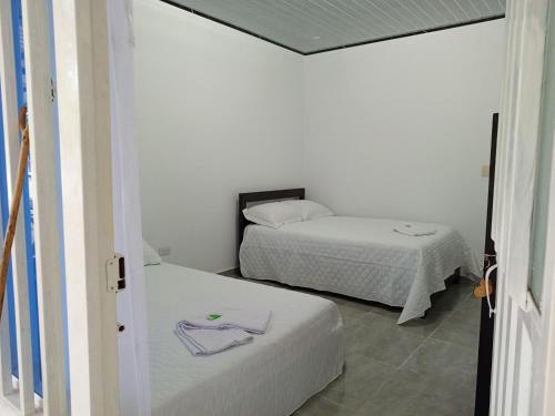 Giường trong phòng chung tại Habitación Hilmar