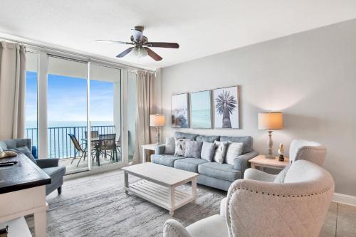 a living room with a couch and a table at Lighthouse 1713 in Gulf Shores
