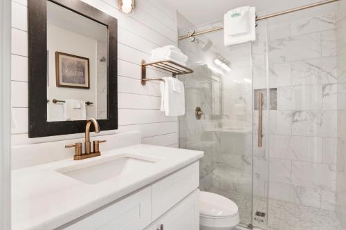 a white bathroom with a sink and a shower at Phoenix X 1201 in Perdido Key