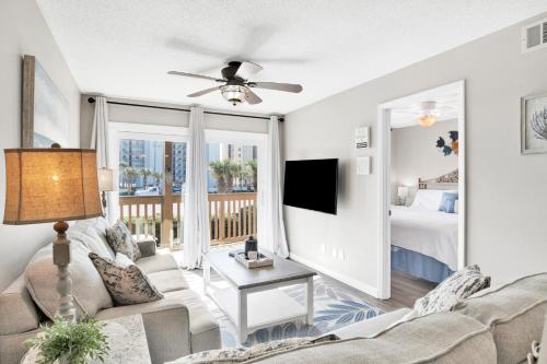 a living room with a couch and a bed at Lei Lani M119 in Orange Beach
