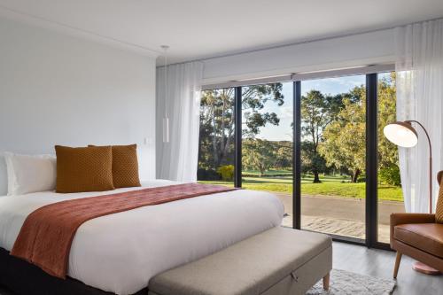 Ένα ή περισσότερα κρεβάτια σε δωμάτιο στο Izzy's Retreat