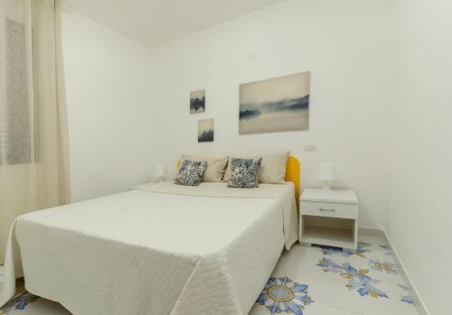 Ένα ή περισσότερα κρεβάτια σε δωμάτιο στο Le Case Di Chri