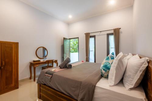 Una cama o camas en una habitación de Pristine penida