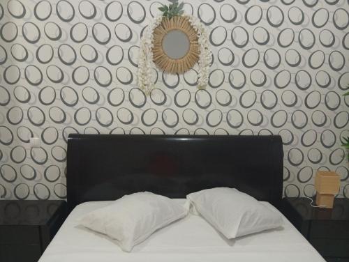 En eller flere senge i et værelse på Four Palms Boutique Hotel