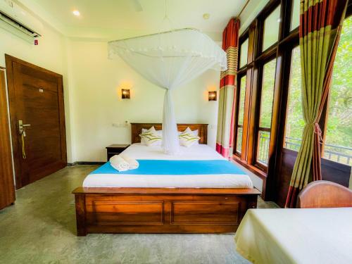 Una cama o camas en una habitación de Sunworld Villa