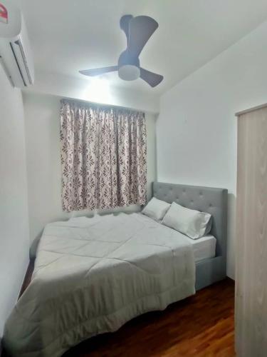 En eller flere senge i et værelse på K-Avenue Mumui's Homestay