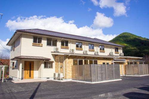 a house with a solarium on top of it at つわの寮 ゲストハウスandコミュニティスペース in Tsuwano