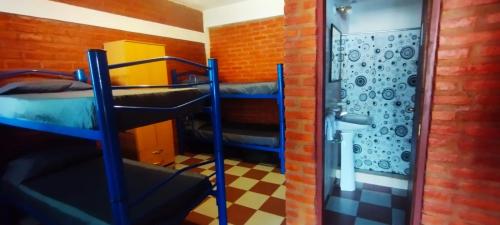 Μία ή περισσότερες κουκέτες σε δωμάτιο στο Habitación Compartida Tipo Hostel para los más aventureros