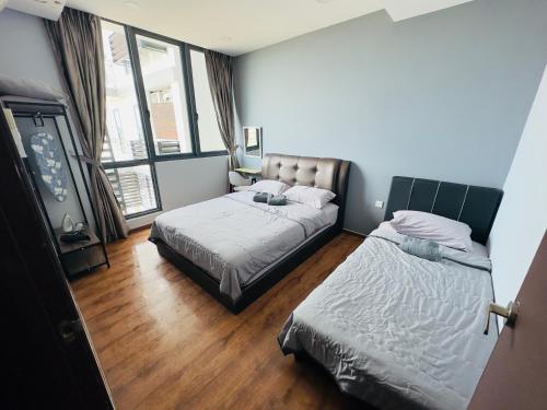 Ένα ή περισσότερα κρεβάτια σε δωμάτιο στο Chloe Homestay, Jazz Suites 1, Vivacity Megamall