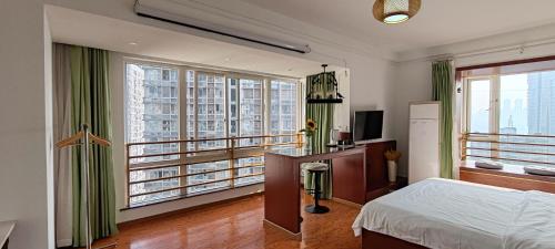 Ένα ή περισσότερα κρεβάτια σε δωμάτιο στο Chongqing Justom Family Serviced Apartments 1