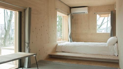 Ένα ή περισσότερα κρεβάτια σε δωμάτιο στο Snow Peak LAND STATION HAKUBA - Vacation STAY 12869v