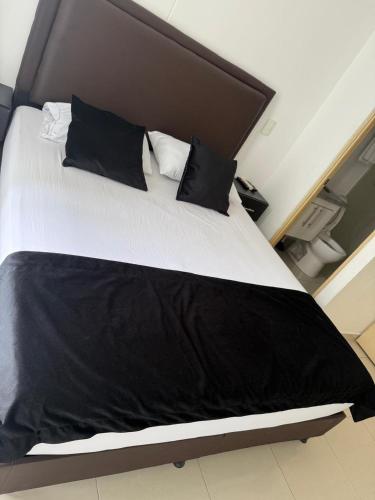 Ένα ή περισσότερα κρεβάτια σε δωμάτιο στο Moderno apartamento amoblado 2 habitaciones