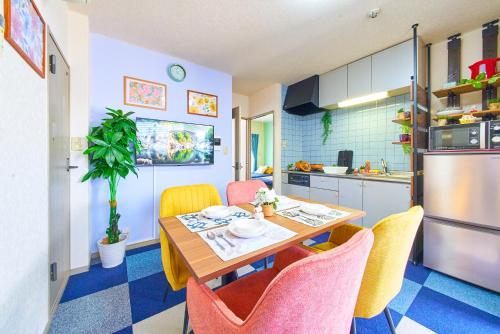 a kitchen with a table and chairs in a room at AO303 - Tokyo Stay Spacious Apartment Direct Train to Narita & Asakusa in Tokyo