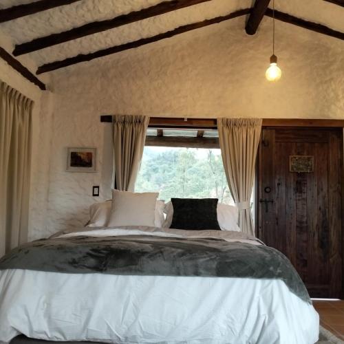 Postel nebo postele na pokoji v ubytování Posada Iglesia Vieja