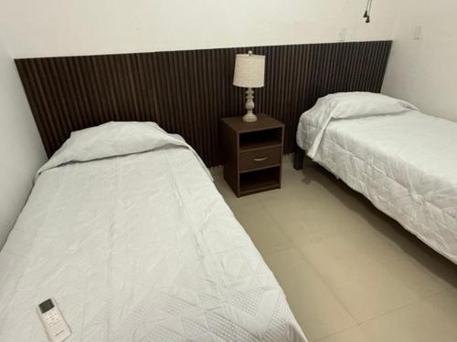 Ένα ή περισσότερα κρεβάτια σε δωμάτιο στο Suite La Lomita #4 Climatizada